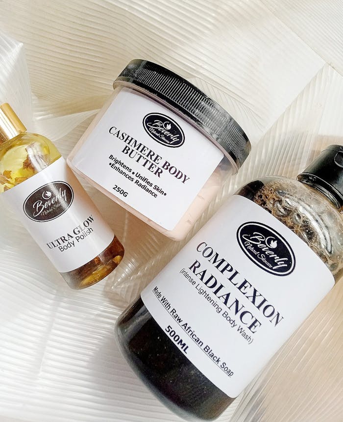 Top view of natural skincare products including body butter and body polish for beauty treatments.